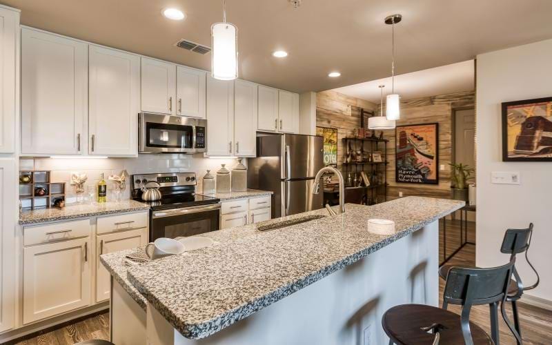 a kitchen with white cabinets
