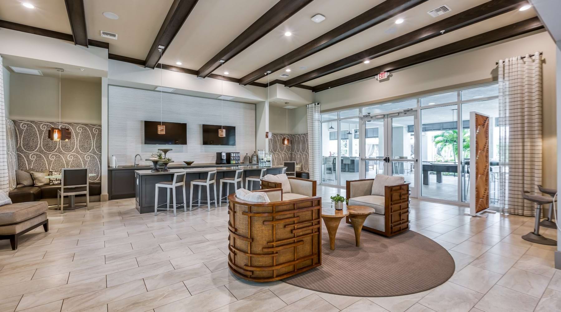 a spacious clubroom with tvs